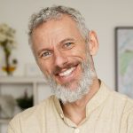 Donald Shane-Smiling relaxed mature older bearded hipster man